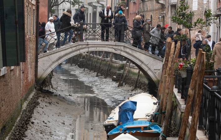 A prolonged drought across Europe has reduced some of Venice’s canals to puddles